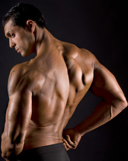 male physique competitor posing