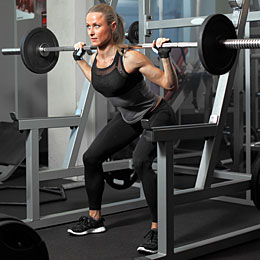 woman performing squat exercise