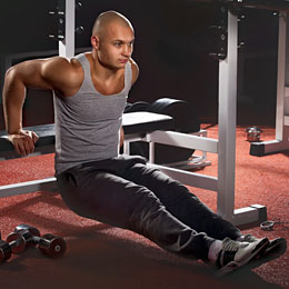 man performing triceps dips