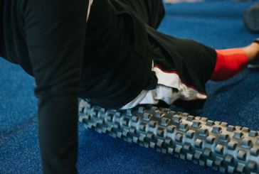 man foam rolling