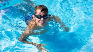 smiling boy swimming