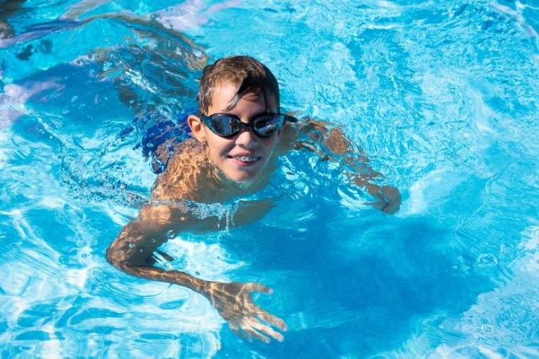 smiling boy swimming