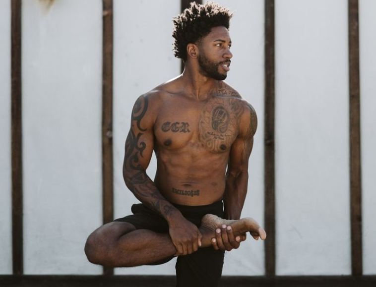 man doing yoga stretch