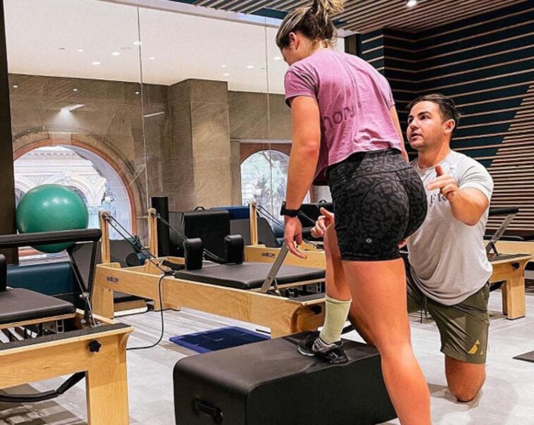 physiotherapist with client