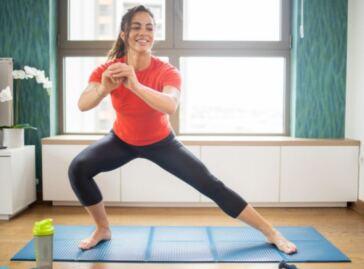 woman exercising at home