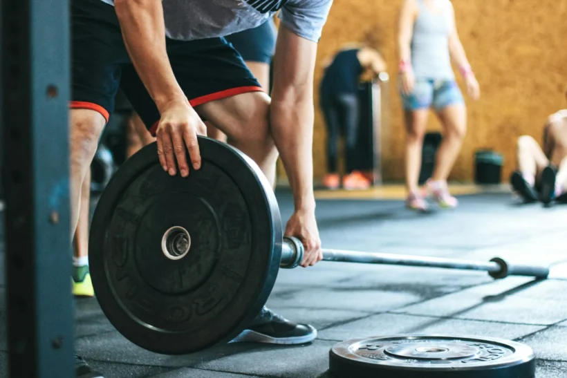 man lifting weights